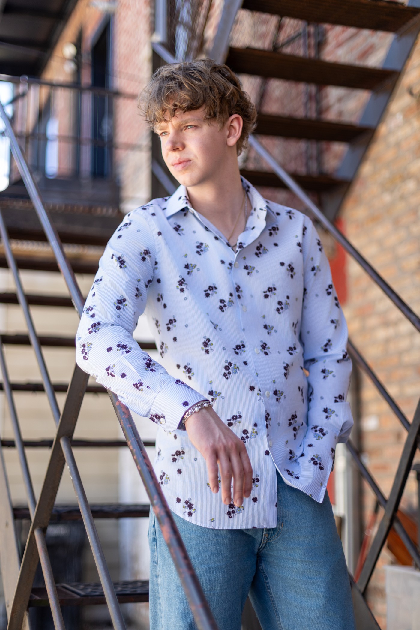 Christopher on a fire escape in New York